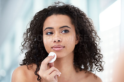 Buy stock photo Bathroom, cleaning and woman with cotton pad in mirror for skincare, hygiene and morning routine. Home, exfoliate and reflection of person with product for facial cleanse, treatment and dermatology