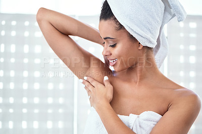 Buy stock photo Cropped shot of a young woman touching her armpits