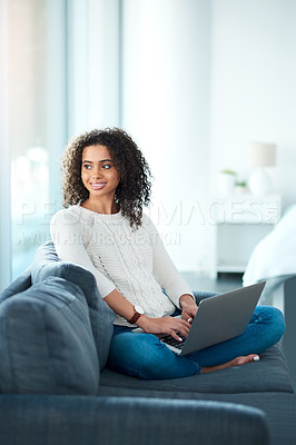 Buy stock photo Woman, laptop and thinking in home on remote work, relax and couch for social media or communication. Female person, freelancer and living room for reflection, typing and website for online research