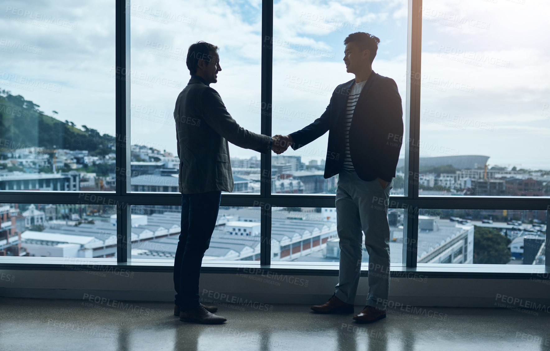 Buy stock photo Introduction, handshake and business people meeting at window for welcome, networking or onboarding. B2b deal, agreement and men shaking hands together for partnership, support and client opportunity