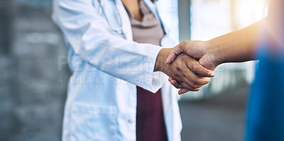 Buy stock photo Closeup shot of two medical practitioners shaking hands