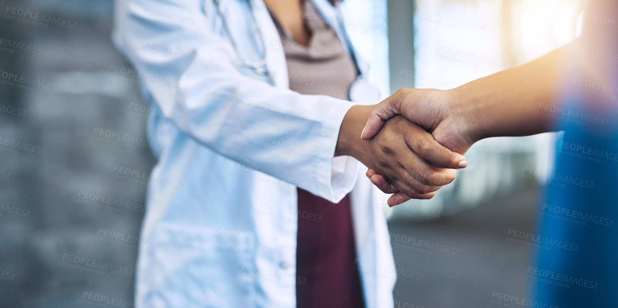 Buy stock photo Closeup shot of two medical practitioners shaking hands