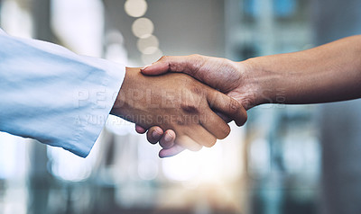 Buy stock photo Closeup shot of two medical practitioners shaking hands