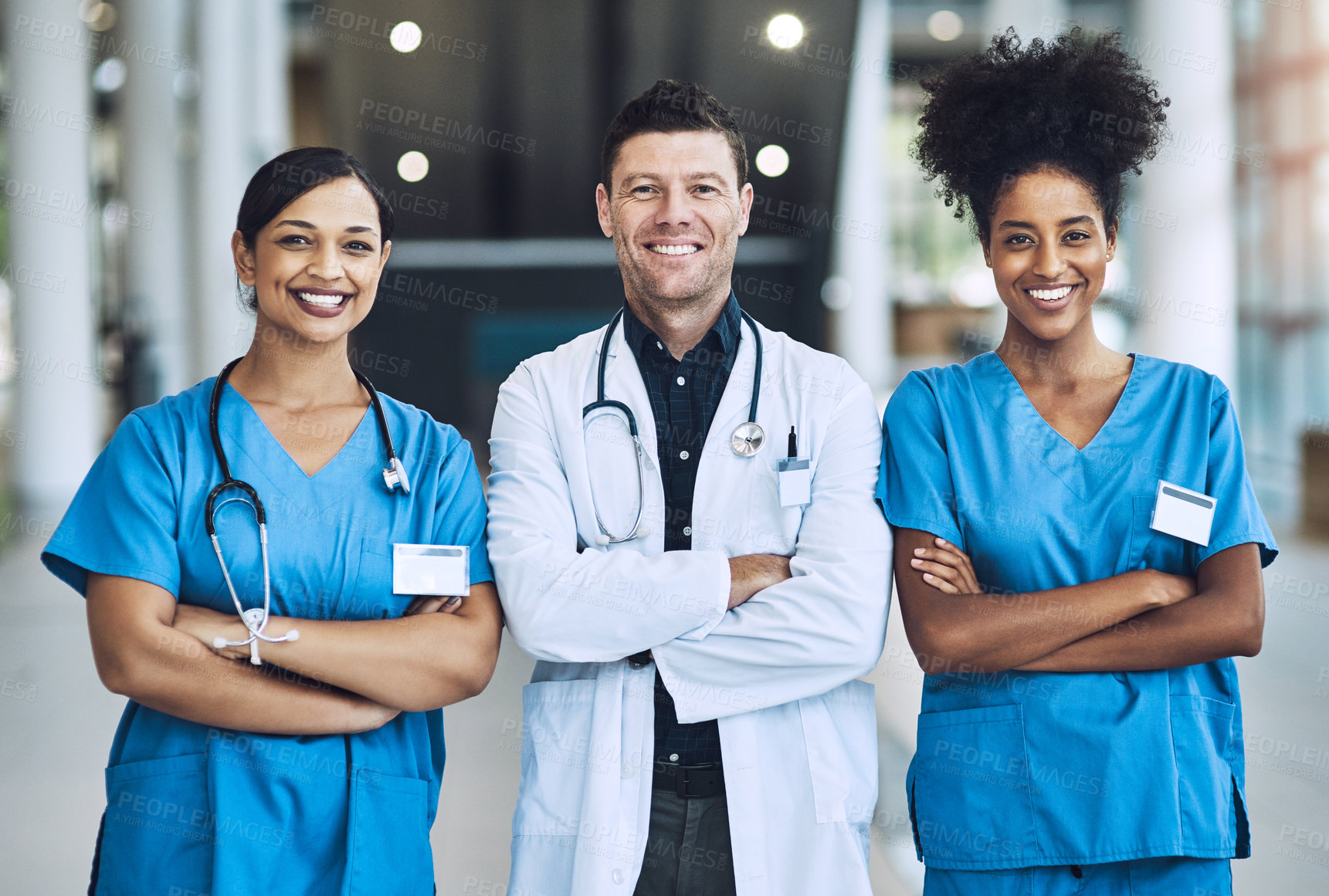 Buy stock photo Solidarity, team and arms crossed in hospital, portrait and support or collaboration for medicine. Doctors, confident and proud of healthcare treatment or diagnosis, nurses and together in clinic