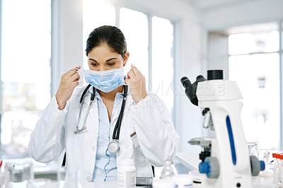 Buy stock photo Woman, doctor and mask with microscope for forensic, science or medical discovery at laboratory. Female person, biologist or scientist with protection for chemical, virus or health and safety at lab