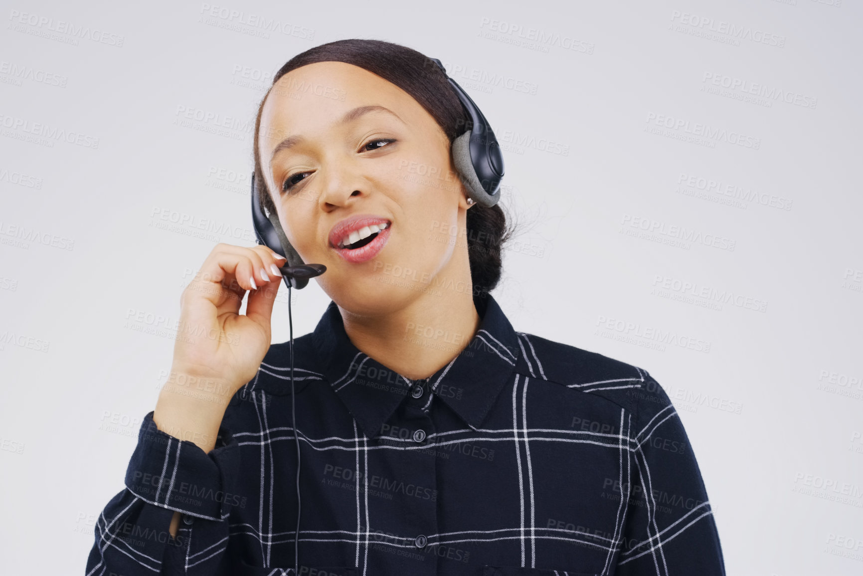 Buy stock photo Studio shot of an attractive young female customer service representative wearing a headset against a grey background
