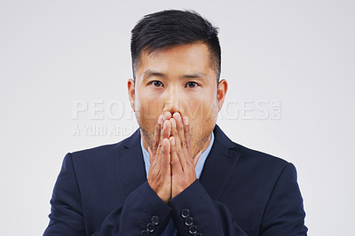 Buy stock photo Studio shot of a young man looking shocked against a grey background