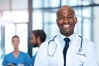 Buy stock photo Man, leader and portrait of doctor in hospital, healthcare or clinic with medical expert nurses to trust in quality care. Black person, face and happy cardio surgeon with confidence in medicine