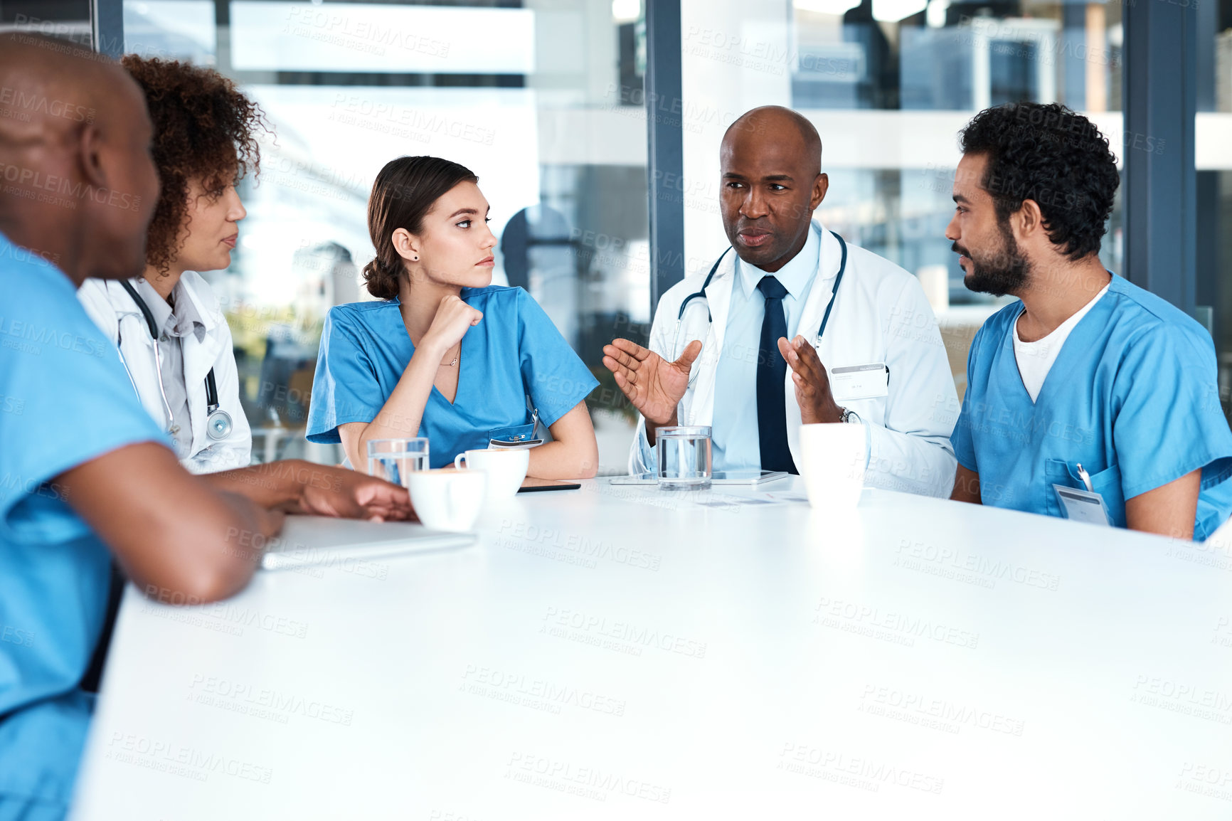 Buy stock photo Diversity, teamwork and doctors in meeting with nurses, hospital and medical strategy for diagnosis and treatment. Discussion, collaboration and healthcare for consulting, planning or surgery results