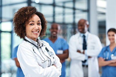 Buy stock photo Arms crossed, leadership and medical with portrait of doctor in hospital with team for collaboration Healthcare, proud and smile with happy woman medicine professional in clinic for treatment