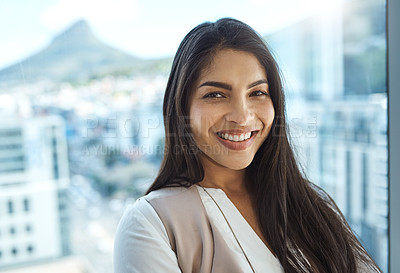 Buy stock photo Portrait of a confident young businesswoman standing in her office