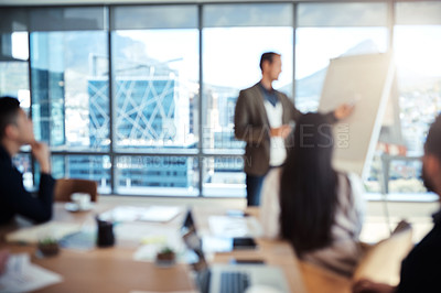 Buy stock photo Blurred shot of a group of businesspeople having a meeting in an office