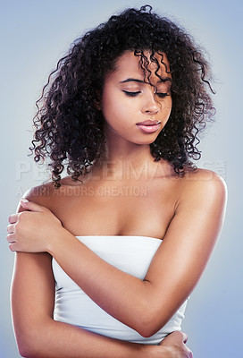 Buy stock photo Studio shot of a beautiful young woman posing against a grey background