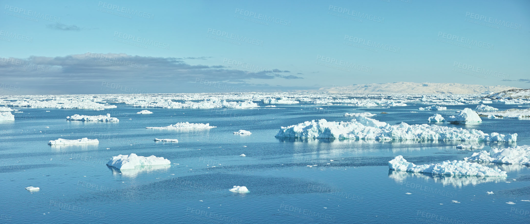 Buy stock photo Beautiful landscape of the sea with ice on a cold winter day with a blue sky with copy space. Small iceberg in the ocean outdoors in nature in the North Atlantic with copyspace