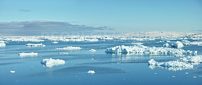 Buy stock photo Beautiful landscape of the sea with ice on a cold winter day with a blue sky with copy space. Small iceberg in the ocean outdoors in nature in the North Atlantic with copyspace