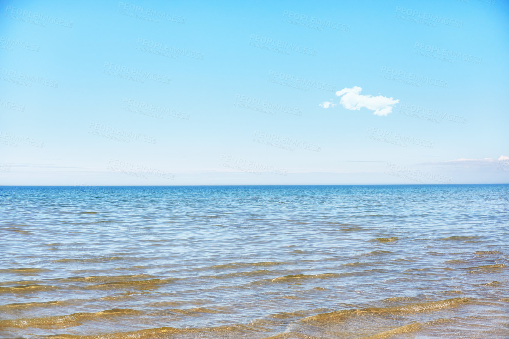 Buy stock photo Beach with a blue sky and copy space on a summer day. Peaceful and scenic view of the ocean seascape with copyspace. Calm empty sea landscape at low tide outdoors in nature 