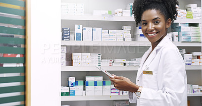 Buy stock photo Cropped portrait of an attractive  young pharmacist using a digital tablet in a chemist