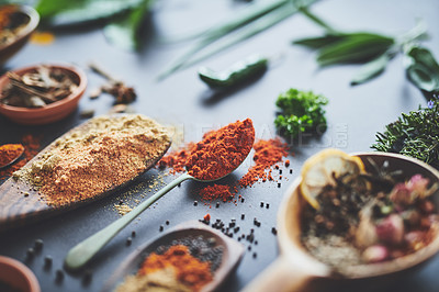 Buy stock photo Kitchen, herbs and spices with spoon on counter with ingredients, flavor and seasoning for cooking. Seeds, leaves and above utensils on table for meal prep, curry and variety for food at restaurant