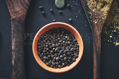 Buy stock photo Peppercorn, kitchen and spices in bowl on background for healthy, natural and organic food. Table, top view and black pepper above for seasoning herbs, condiments and cooking powder with ingredients