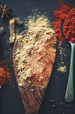 Buy stock photo Table, spoon and selection of curry spices for cooking, flavor and ingredients for dinner food. Cuisine, recipe and collection of organic turmeric, textures and culinary condiments in kitchen.