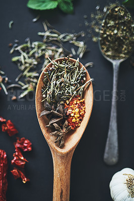 Buy stock photo Herbs, kitchen or variety spices on background for healthy, natural or organic Indian food. Table, top view or spoon with crushed red pepper or star anise for seasoning or cooking ingredients closeup