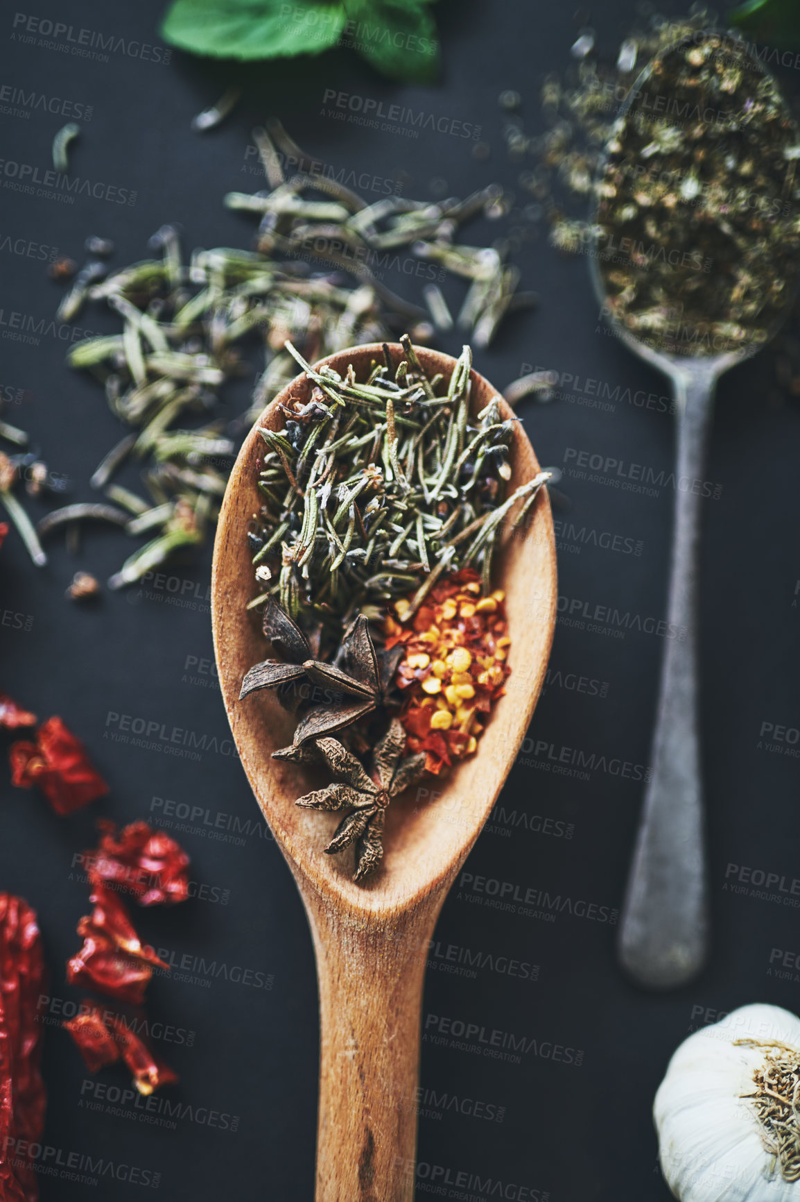 Buy stock photo Herbs, kitchen or variety spices on background for healthy, natural or organic Indian food. Table, top view or spoon with crushed red pepper or star anise for seasoning or cooking ingredients closeup