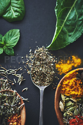 Buy stock photo Cooking, seasoning and herbs with spices in spoon for aroma, restaurant and flavor. Health, nutrition and above of exotic diet on black background for turmeric, kitchen and paprika ingredients