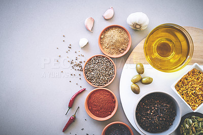 Buy stock photo Bowl, ingredients and board in white background for spices, powder and sensory appeal for creativity with culinary. Studio, condiment and above for cooking with clove, aroma and seasoning collection