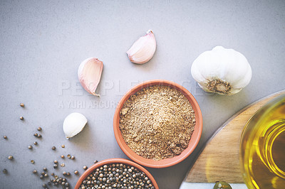 Buy stock photo Bowl, pepper and board in gray background for spices, powder and variety for sensory appeal with culinary. Studio, condiment or flavor for cooking with ingredients, texture or seasoning collection