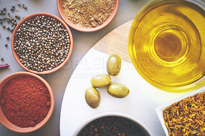 Buy stock photo Top view, bowl and spices in gray background for seasoning, powder and board for sensory appeal with culinary. Studio, condiment and flavor for cooking with ingredients, texture and herbs collection