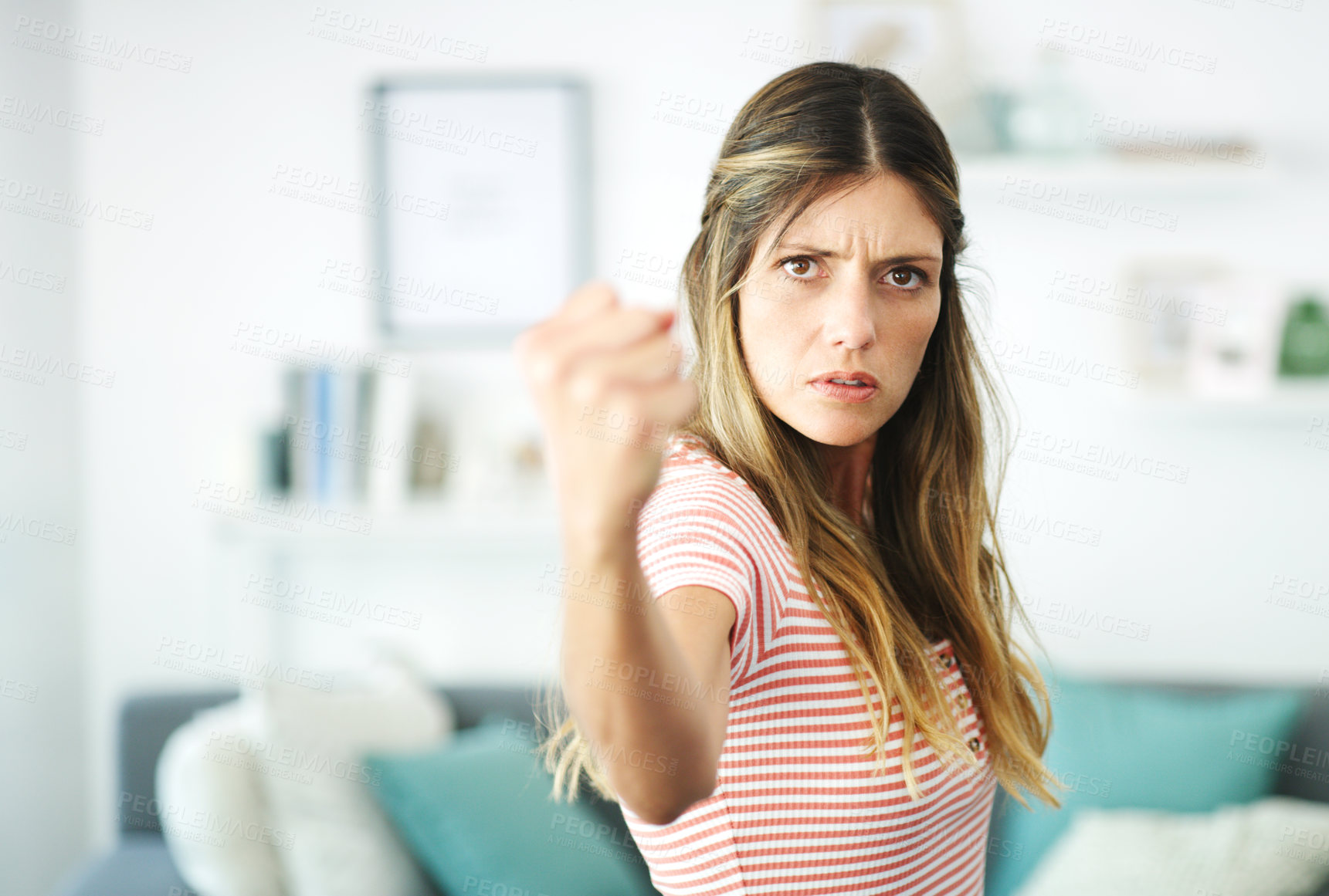 Buy stock photo Cropped shot of an attractive young woman at home