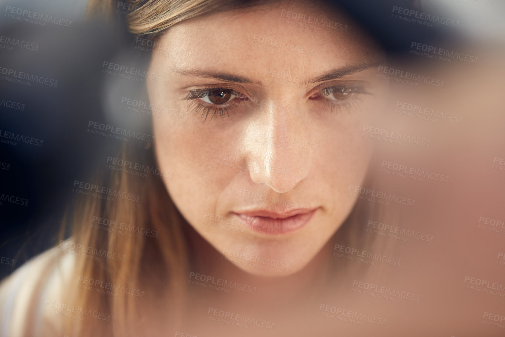 Buy stock photo Cropped shot of an attractive woman looking thoughtful at home
