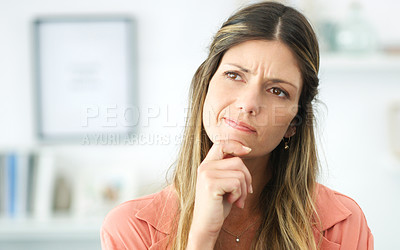 Buy stock photo Cropped shot of an attractive woman looking thoughtful