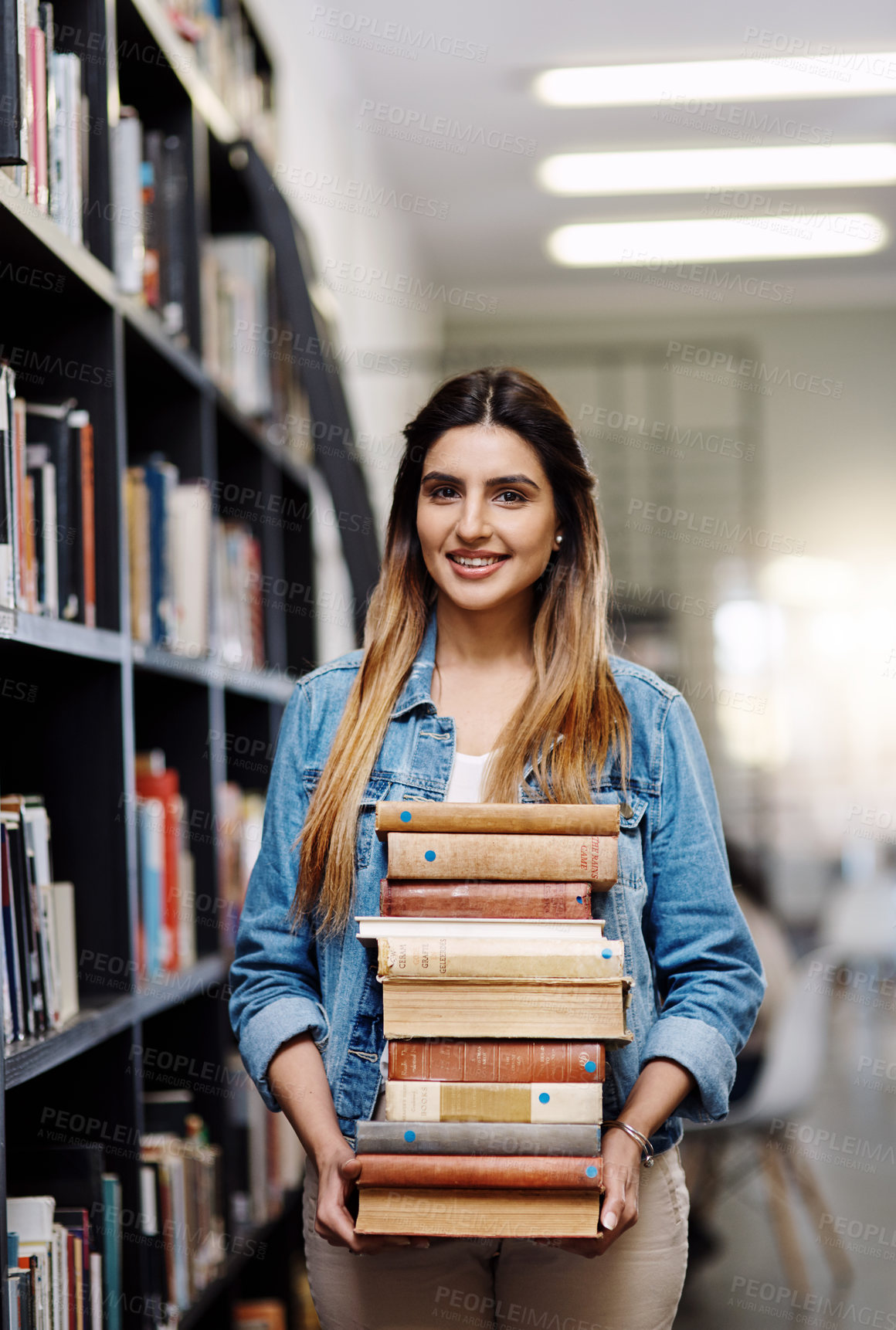 Buy stock photo Woman in portrait, college student with stack of books in library and research, studying and learning on university campus. Female person with smile, education and scholarship with reading material