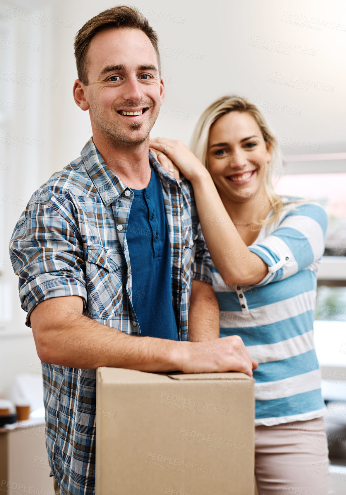 Buy stock photo Portrait, couple and embrace for home, box and man in living room, happy and mortgage for real estate in apartment. Woman, new house and moving with packages, investment and loan for property in USA