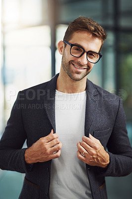 Buy stock photo Shot of a handsome businessman at the office