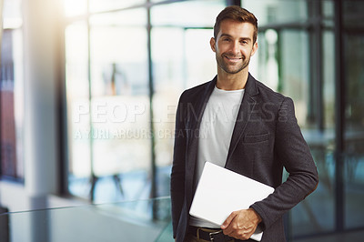 Buy stock photo Cropped shot of a handsome businessman holding a digital tablet