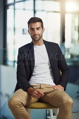 Buy stock photo Portrait shot of a handsome businessman sitting in an office