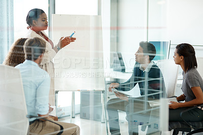 Buy stock photo Cropped shot of a businesswoman giving a presentation during a meeting in the boardroom