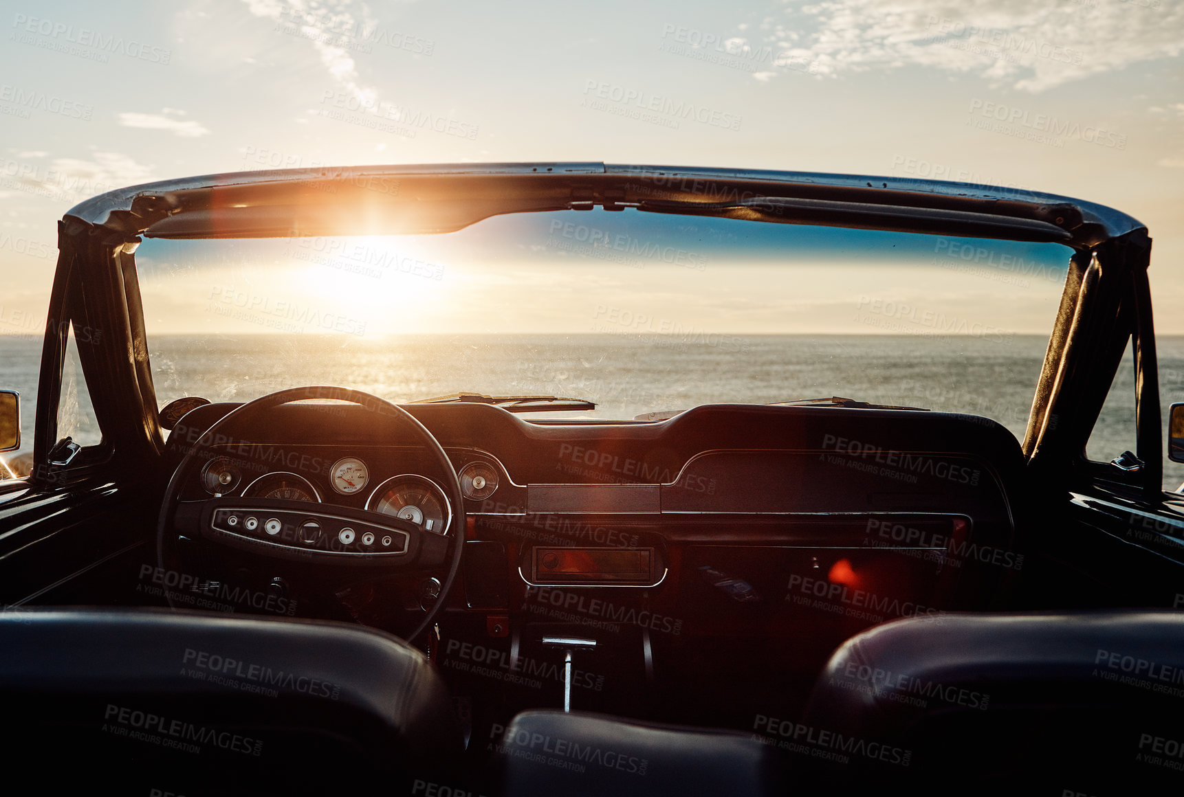 Buy stock photo Retro, car and sunset at beach for travel with road trip, adventure or journey with lens flare. Empty vehicle, vintage convertible and transport on coast at seaside for ocean sunrise or park for view