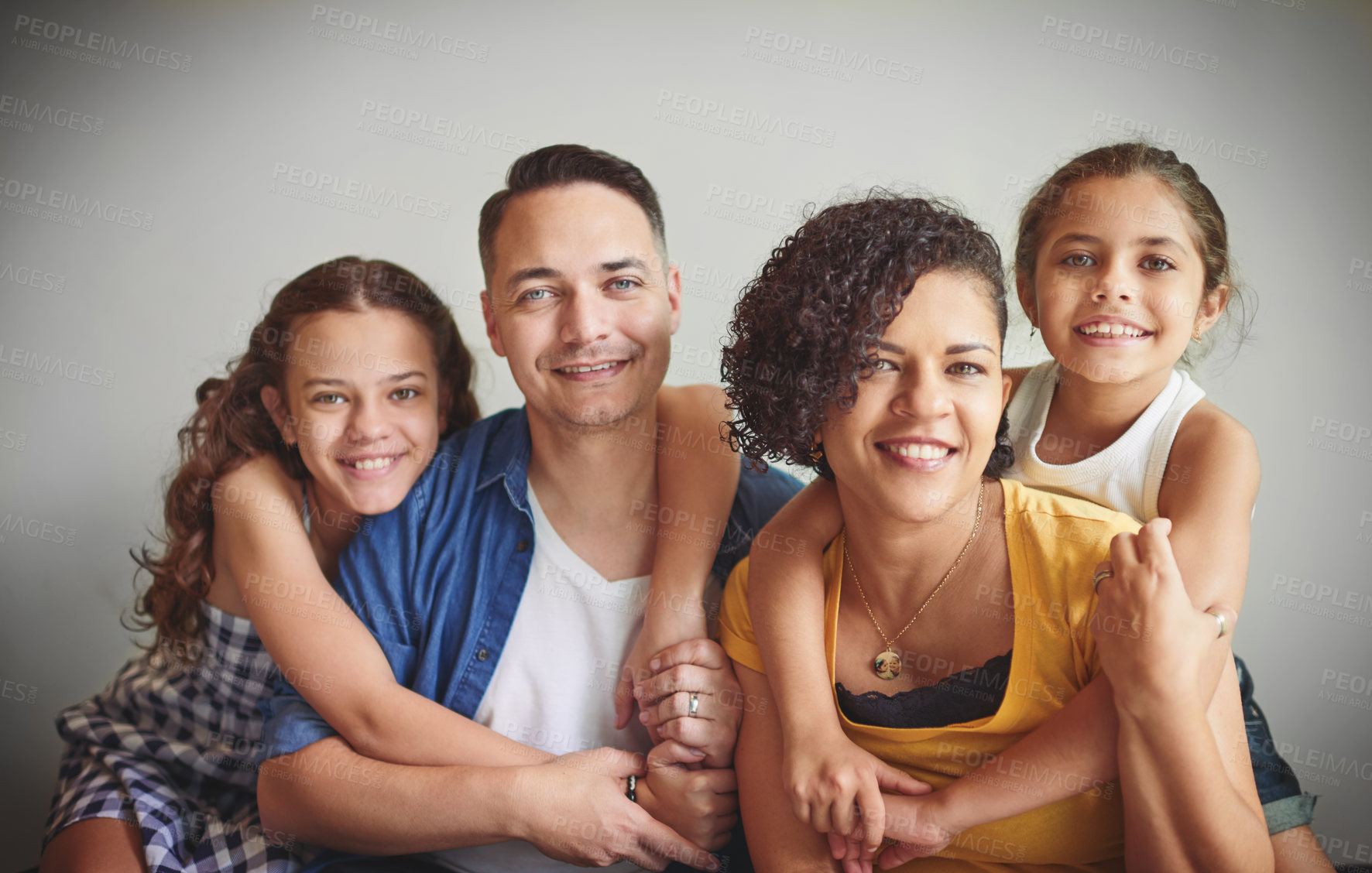 Buy stock photo Portrait of a happy young family spending quality time together