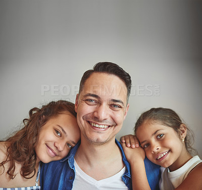 Buy stock photo Shot of a man spending quality time with his young daughters