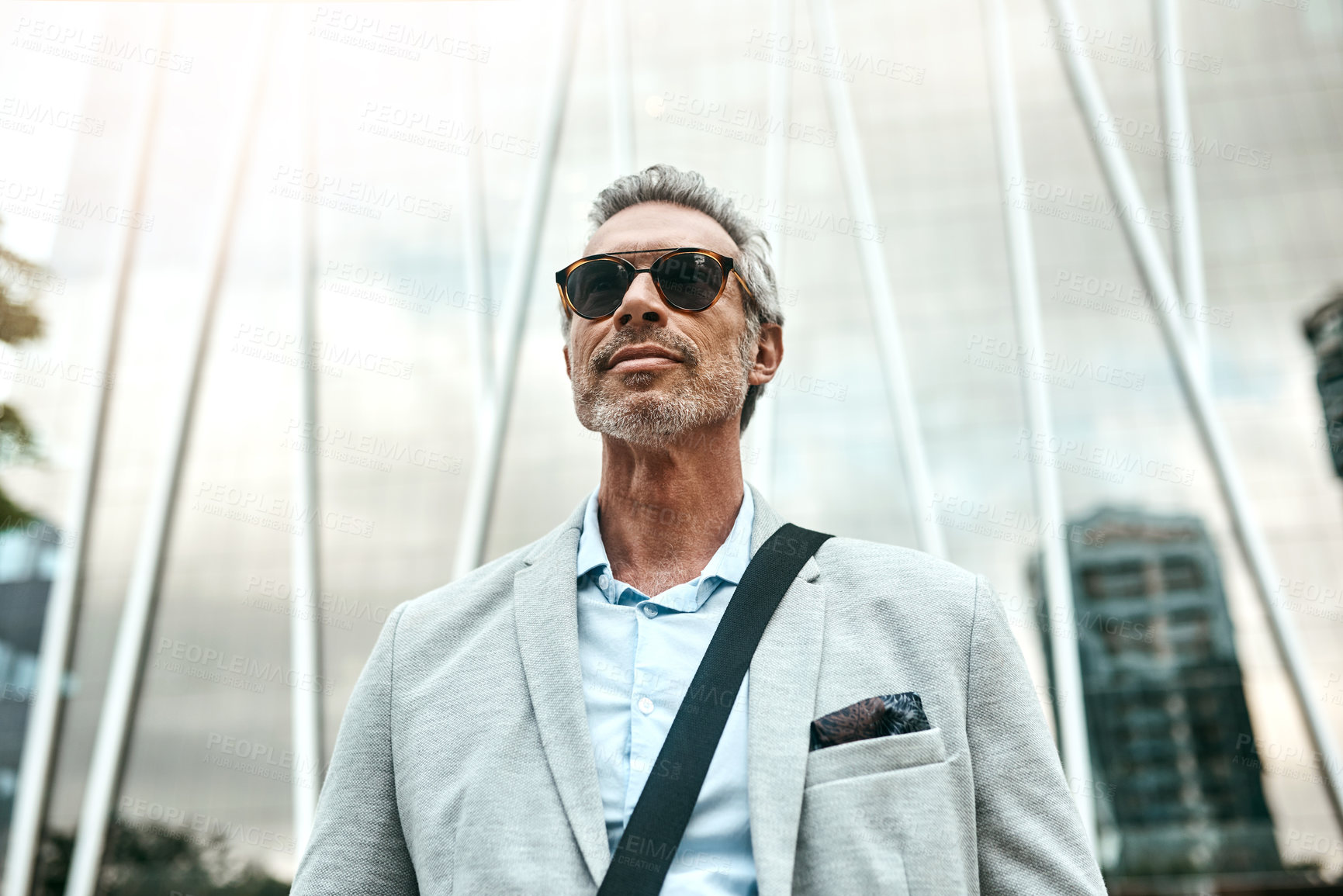 Buy stock photo Shot of a mature businessman out in the city