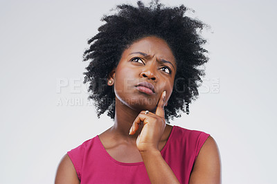 Buy stock photo Confused, thinking and black woman in studio with frown, decision or choice on grey background space. Doubt, suspicious and African female person concerned, unsure or pensive and contemplating 