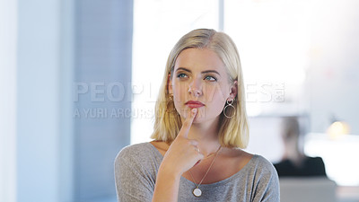 Buy stock photo Cropped shot of a confident young businesswoman contemplating while standing inside of the office at work