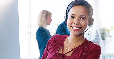 Buy stock photo Cropped shot of a cheerful young businesswoman wearing a headset while talking to a client over the phone inside of the office