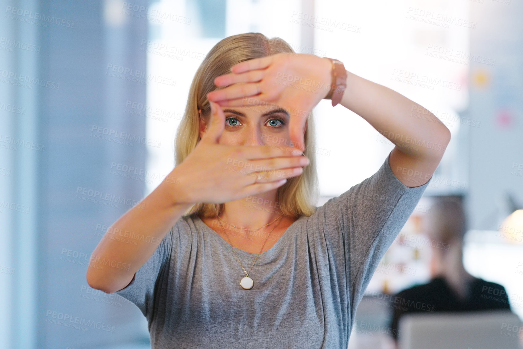 Buy stock photo Portrait, frame and hands with eyes of woman in office for focus, vision or to measure size. Creative, design and photography with confident young business person in workplace for project development