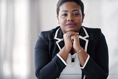 Buy stock photo Cropped portrait of an attractive young businesswoman sitting behind her desk in the office