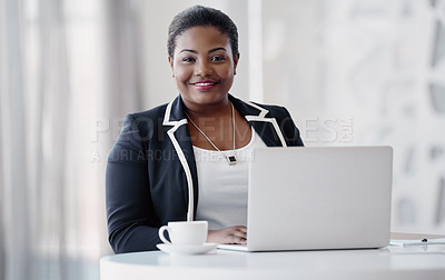 Buy stock photo Cropped portrait of an attractive young businesswoman using her laptop while working in the office