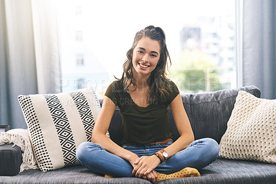 Buy stock photo Full length shot of a beautiful young woman relaxing on her sofa at home